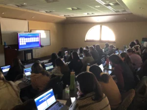 Image of teachers working on computers during a PD session with Short Answer