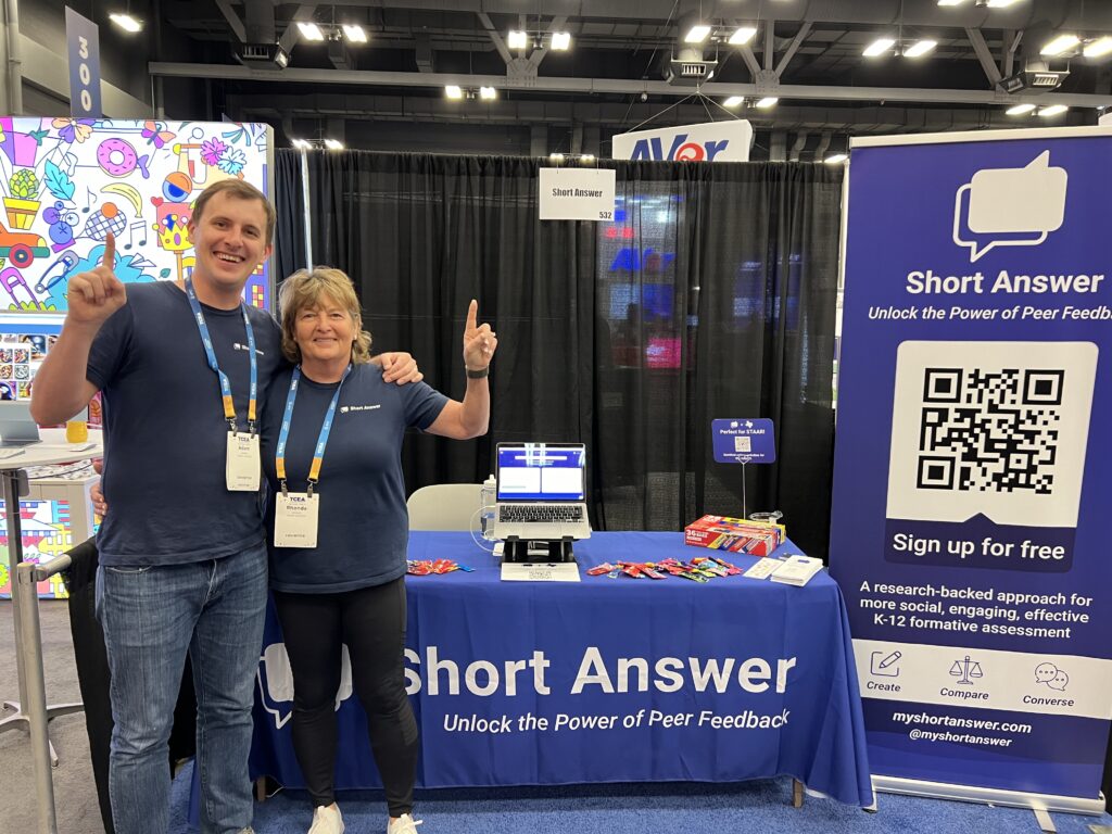Adam & Rhonda Sparks smiling at the Short Answer booth at TCEA