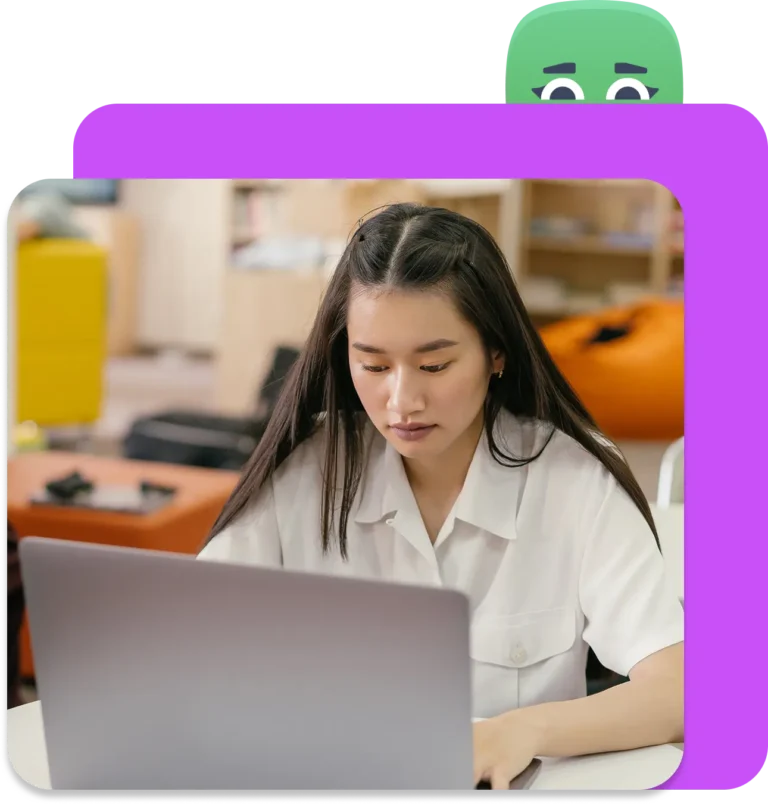 A girl typing a response on a laptop